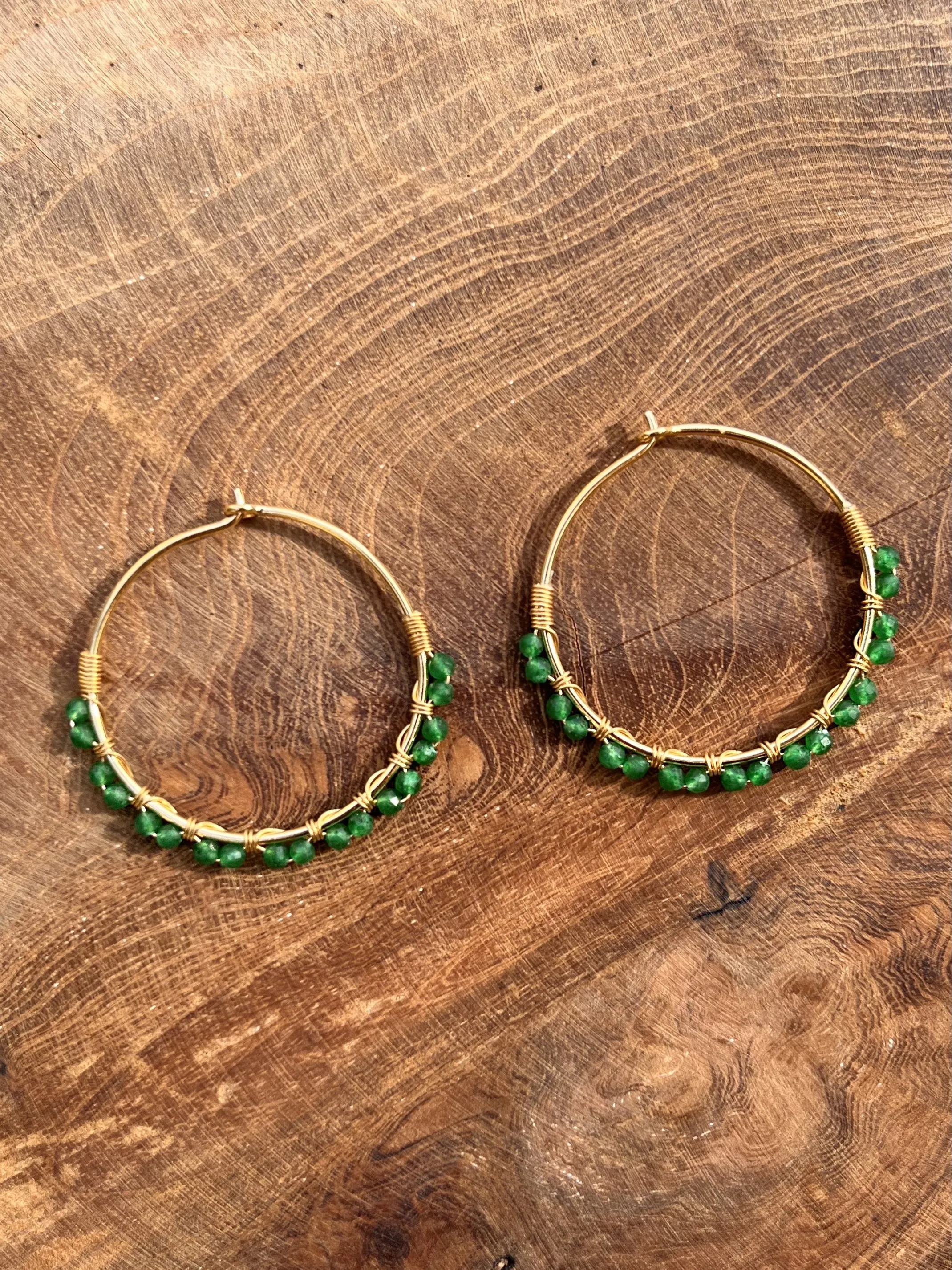 18k yellow gold earrings set with emeralds
