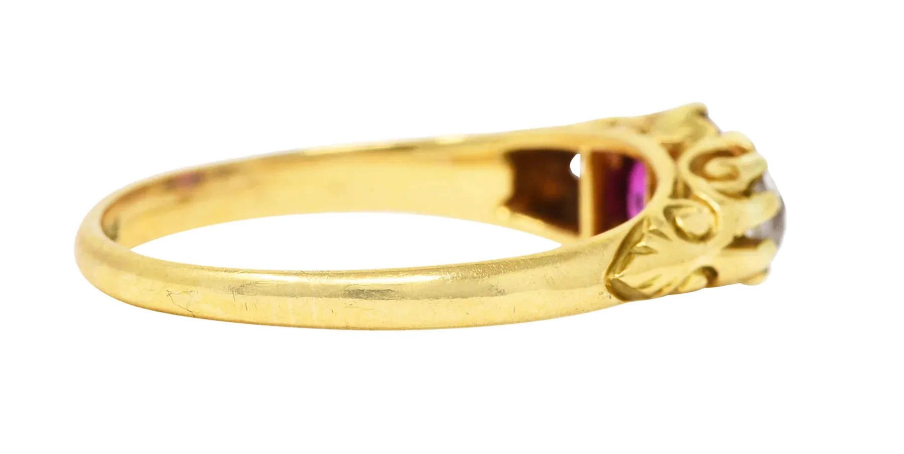 VICTORIAN 1.64 CTW RUBY OLD MINE CUT DIAMOND 18 KARAT YELLOW GOLD SCROLLING THREE-STONE ANTIQUE RING